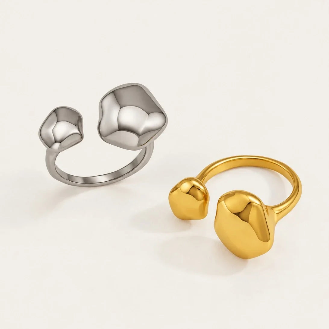 Gold and silver-tone Cloud RINGS: open adjustable rings with two smooth pebble-shaped ends — Folie à Trois