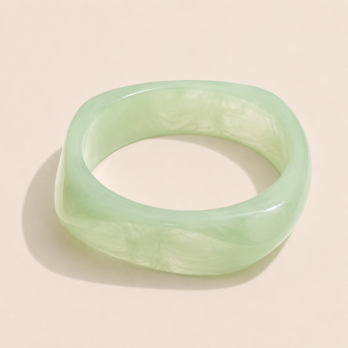 Coastal Escape BRACELET in green marbled resin, a chunky angular bangle shown alone on a cream background.