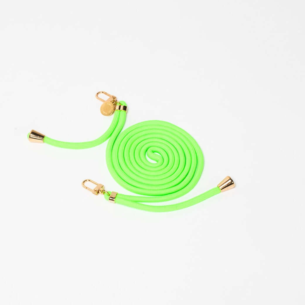 Neon green Colorful PHONE CORD coiled with gold-tone hardware on a white background.