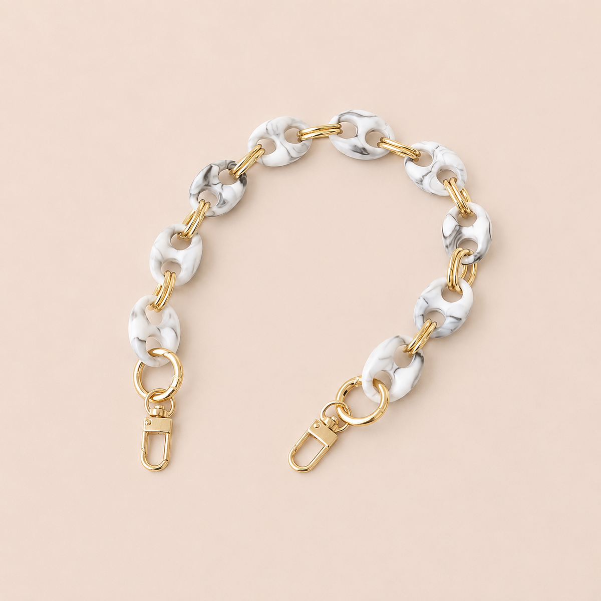 Round white and black marbled coin-link phone chain with gold connectors on cream — Folie à Trois Corvin short phone chain