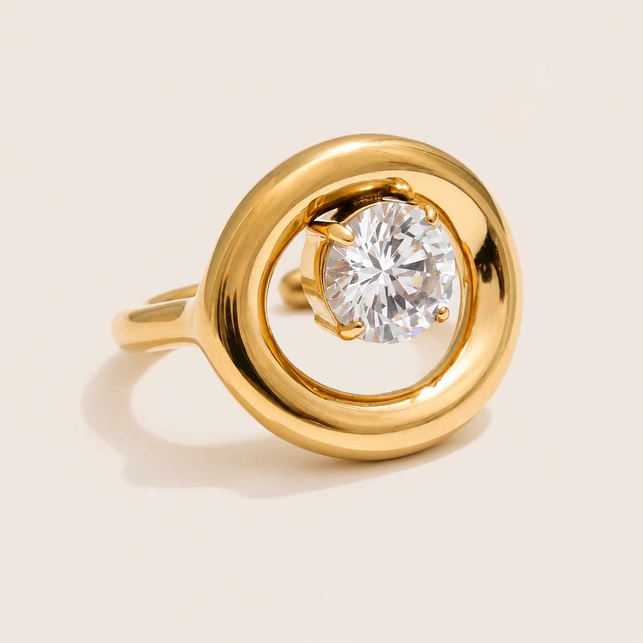 Gold ring with a thick circular loop framing a large round-cut white zirconia stone at its center — Folie à Trois Côte Club RING.