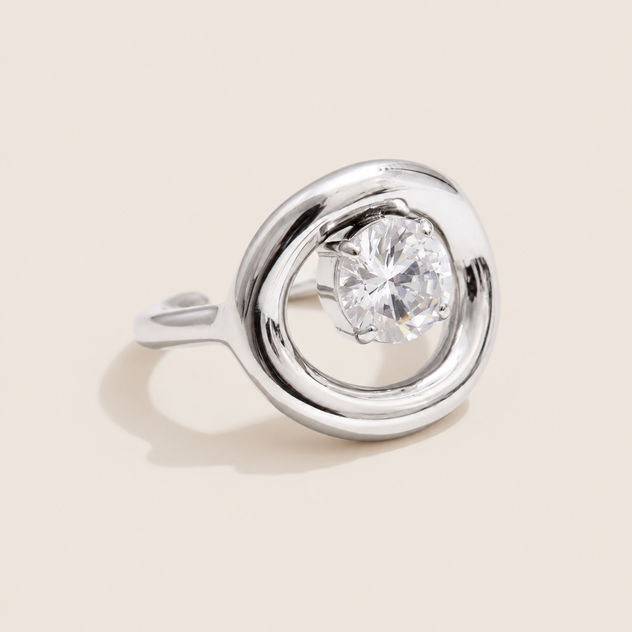 Silver ring with a thick circular loop framing a large round-cut white zirconia stone at its center — Folie à Trois Côte Club RING.