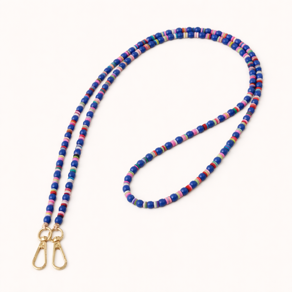 Blue beaded Cove LONG PHONE CHAIN with colorful striped accent beads and a gold clasp, shown as a flat lay.
