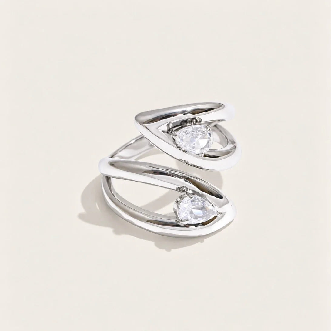 Silver-tone Croisé RING: two overlapping bands crossing around an oval white zirconia stone — Folie à Trois
