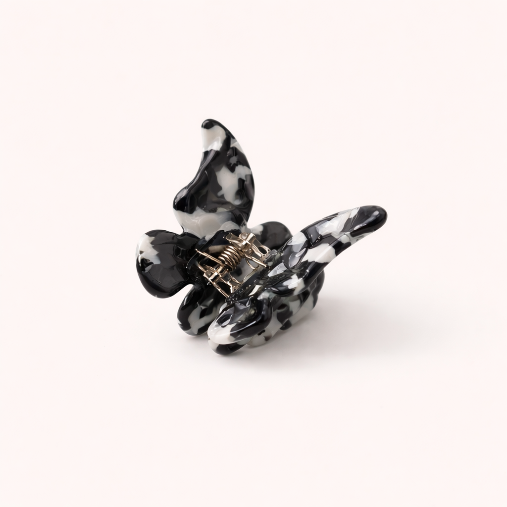 Black and white cow-print acetate butterfly-shaped claw clip from the Falling For You Butterfly HAIR CLIP collection.