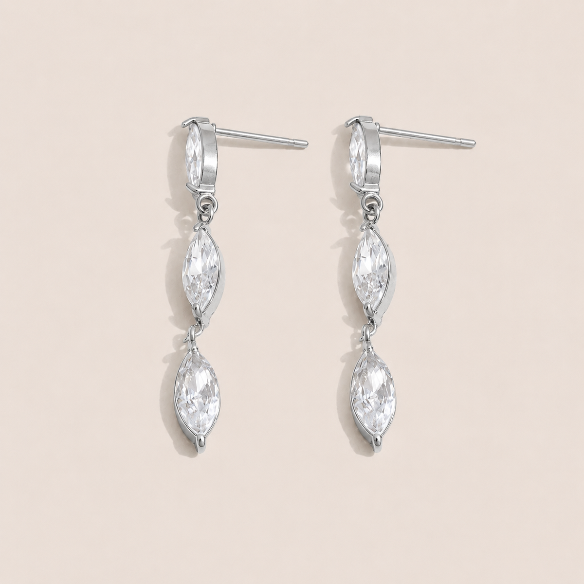 Silver drop earring with two marquise-cut white zirconia stones linked in a row — Folie à Trois Glint EARRINGS.