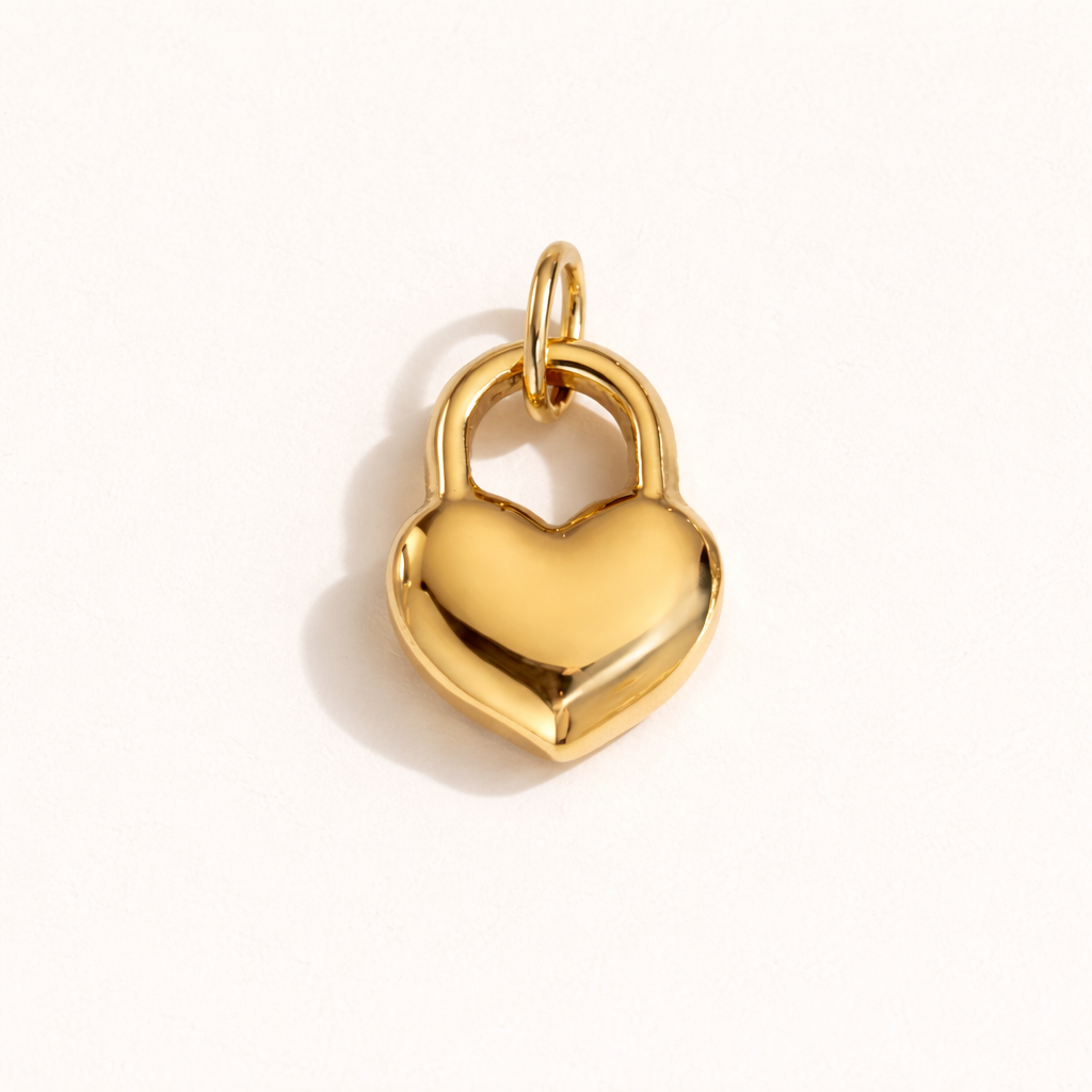 The Heart Locket CHARM in polished gold, its padlock-shaped heart shown alone on a plain white studio background.