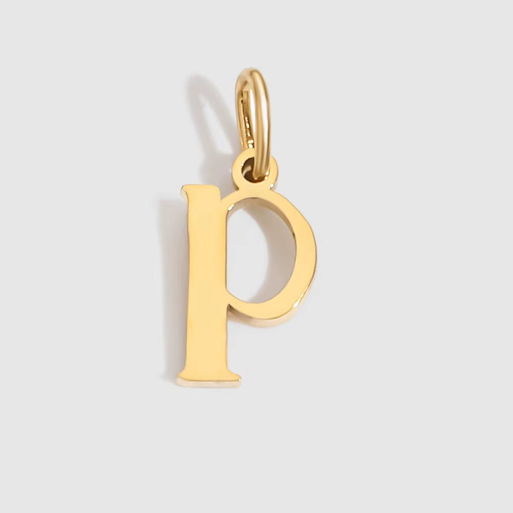 The Letter CHARM in lowercase p, a polished gold pendant in a serif p shape, shown in close-up on a light grey background.