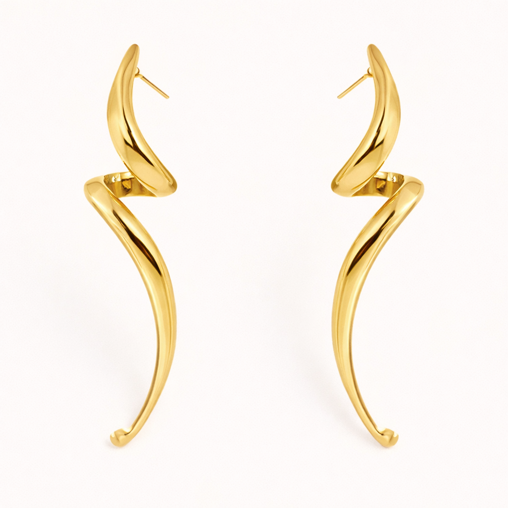 Lo Earrings in gold, an elongated sculptural swirl that curves and tapers downward like a slender horn shape.
