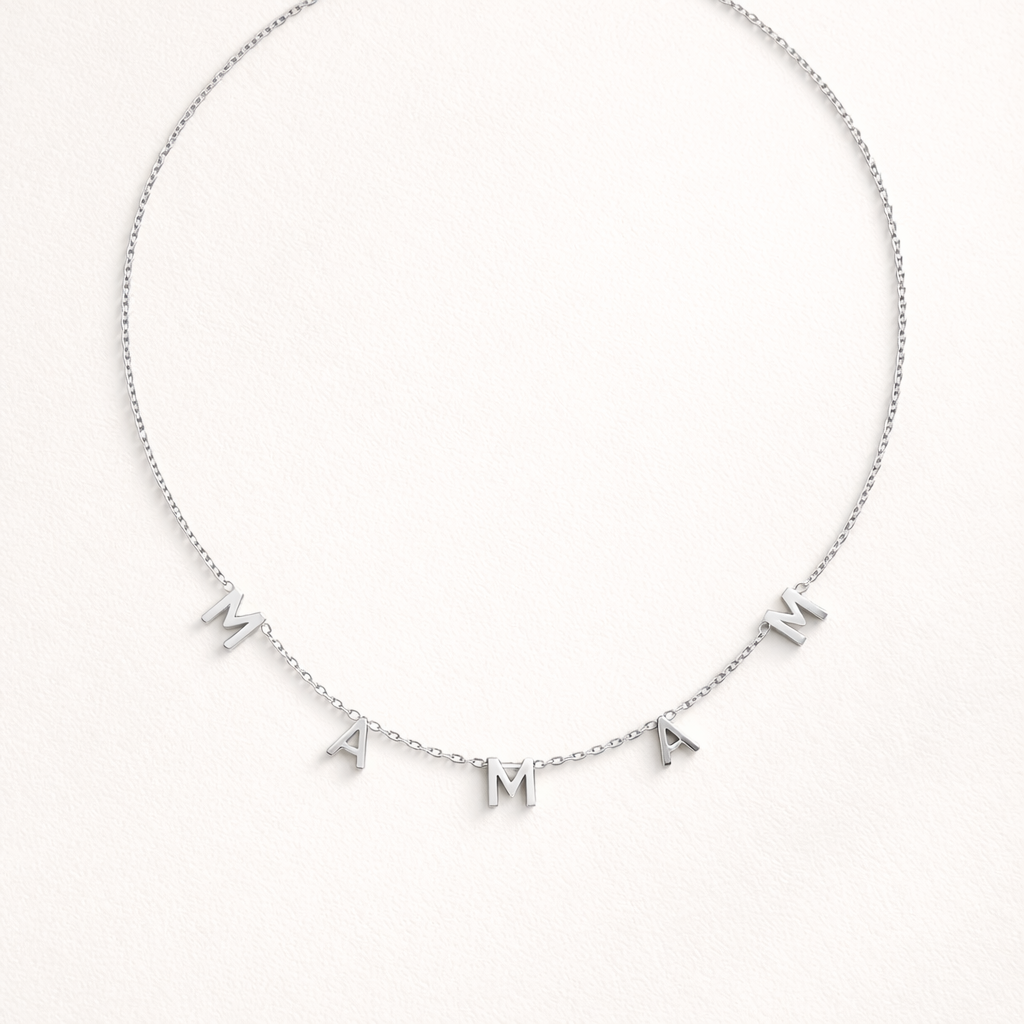 The Maman NECKLACE in silver, individual letters spelling MAMAN dangling from a fine chain, shown flat.