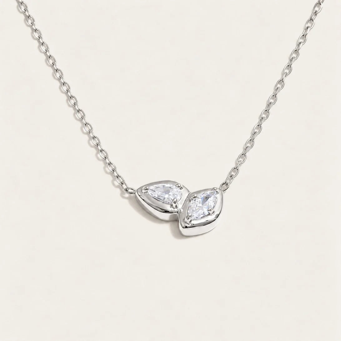 Silver-tone Marquise NECKLACE: a fine chain with a small double-marquise pendant framing a white zirconia — Folie à Trois