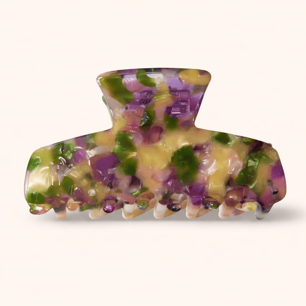 Mood Du Jour HAIR CLIP in a purple, green, and yellow speckled resin claw design, photographed on a cream background.