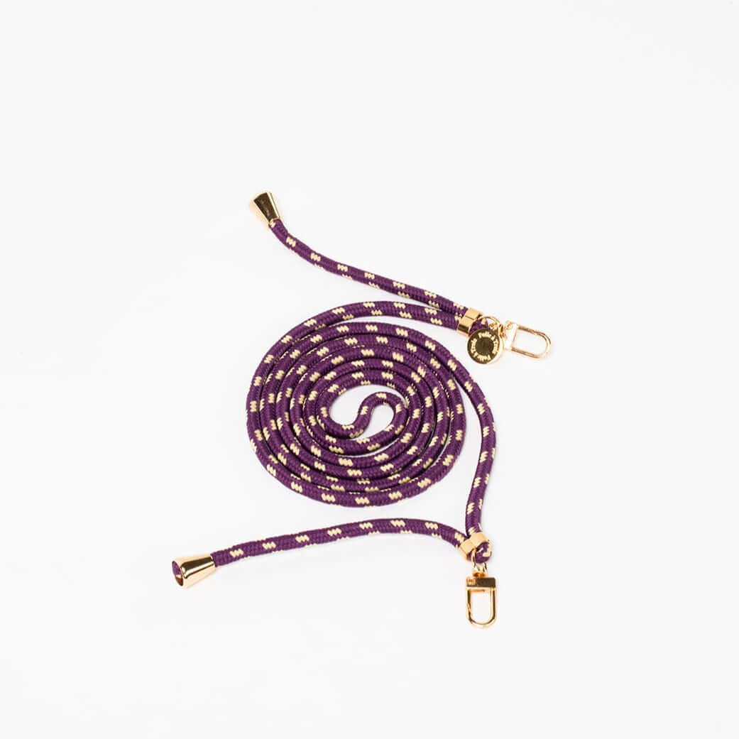 Purple and cream dashed Multi Colorful PHONE CORD coiled with gold-tone hardware on a white background.