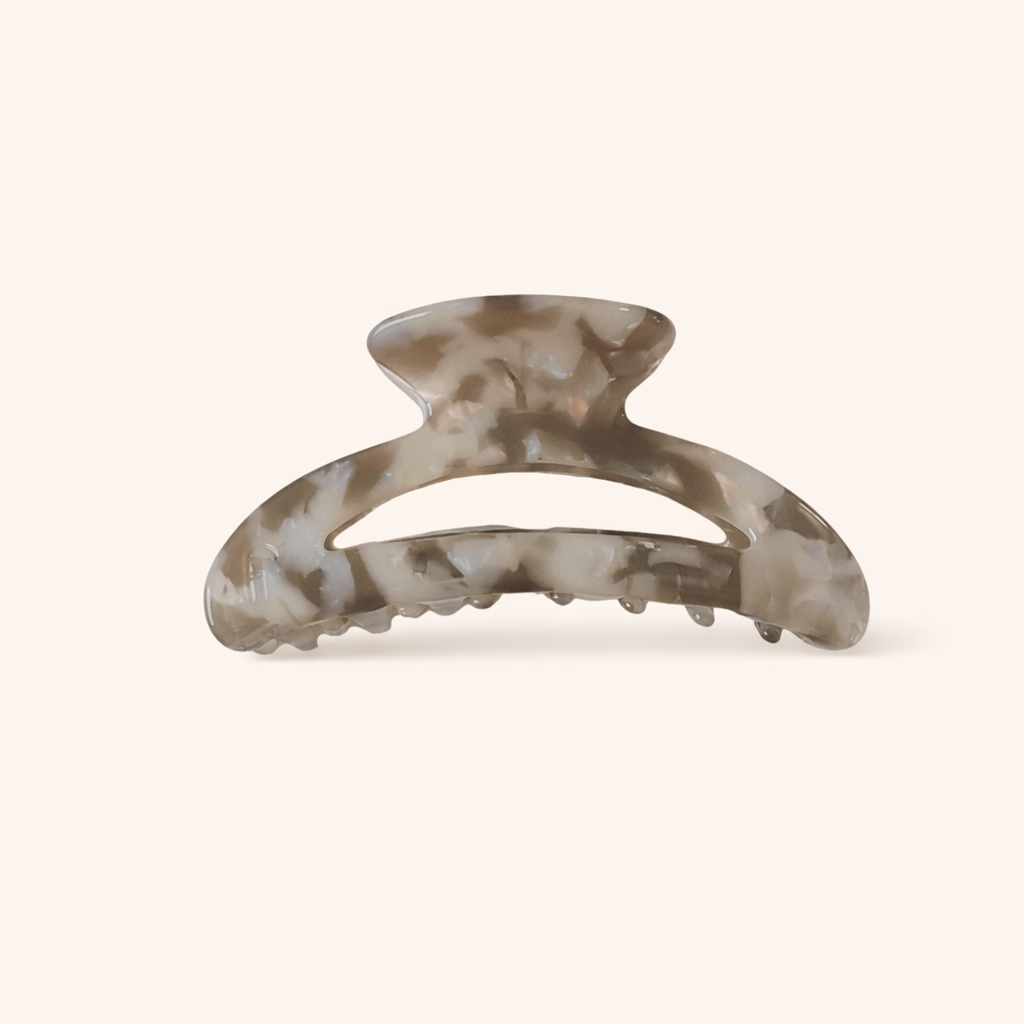 Grey and taupe marbled acetate arched claw clip from the Palm Springs HAIR CLIP collection, on a cream background.