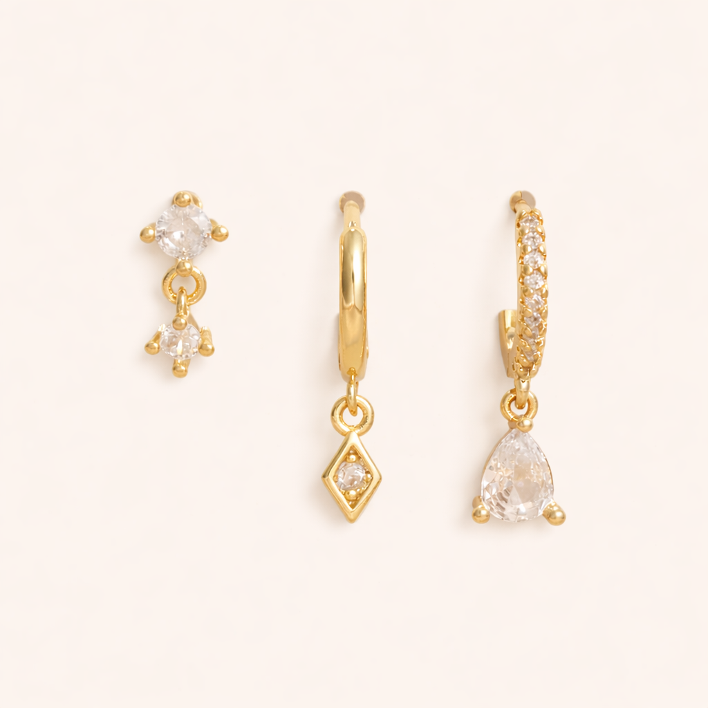 The Piper SET includes a double-crystal drop stud, a plain hoop with diamond drop, and a pave teardrop hoop.
