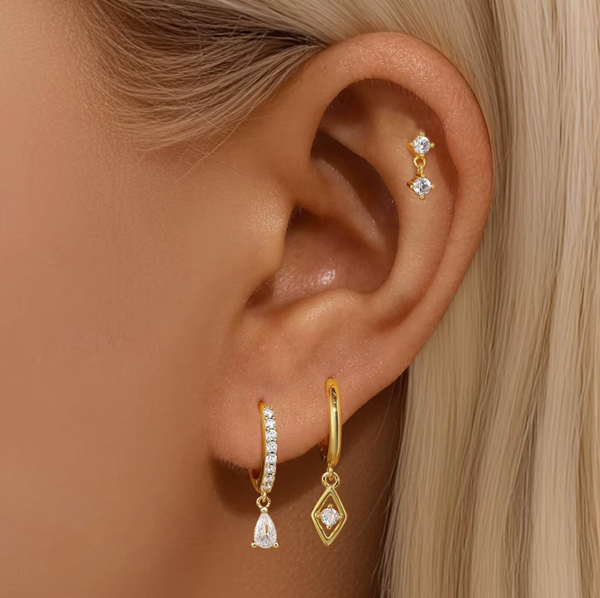 Worn along the cartilage and lobe, the Piper SET pairs a crystal stud with pave and diamond-drop hoops.