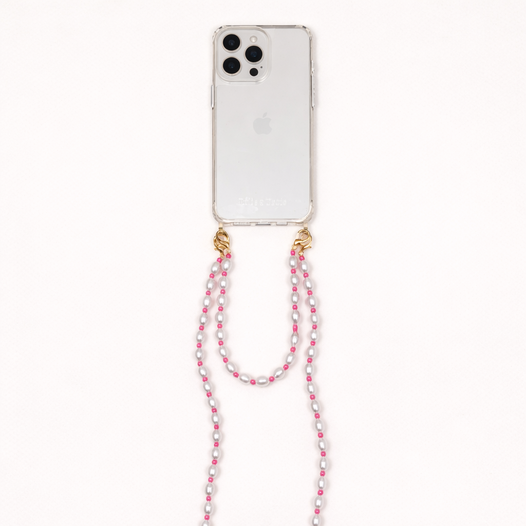 Clear phone case with a white pearl and pink bead Posy Pearl LONG PHONE STRAP hanging down, shown as a flat lay.
