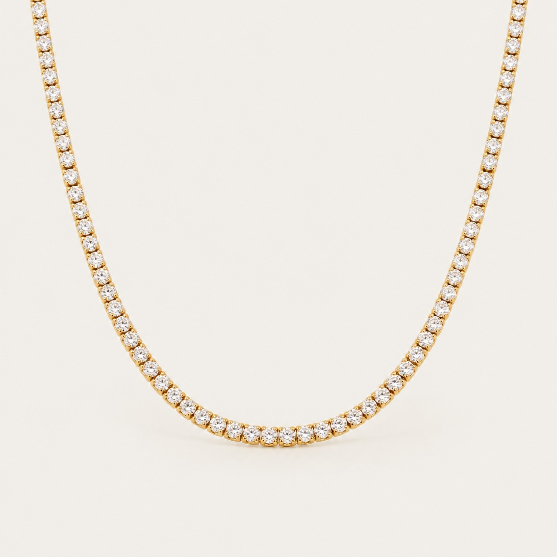 Gold Rivière NECKLACE: a classic tennis necklace lined with sparkling round white zirconia stones — Folie à Trois