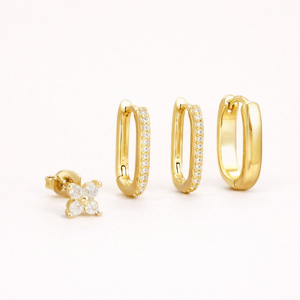 Sophia Set of four gold pieces: a clover stud and three rectangular hoops, two lined with white crystals and one smooth polished.