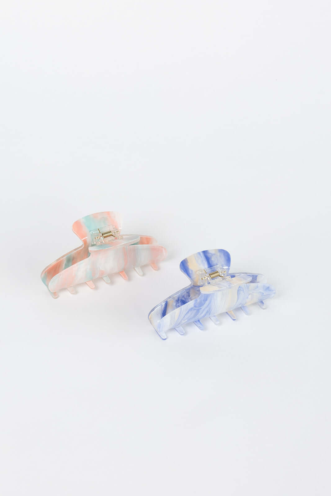 Sundae HAIR CLIP two claw clips shown side by side in peach-mint and blue-cream marbled colorways, studio shot.