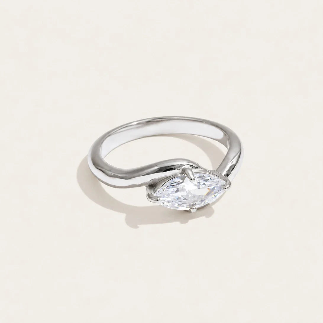 Silver-tone Vague RING: a broad, undulating wave band with a white zirconia set in the curve — Folie à Trois