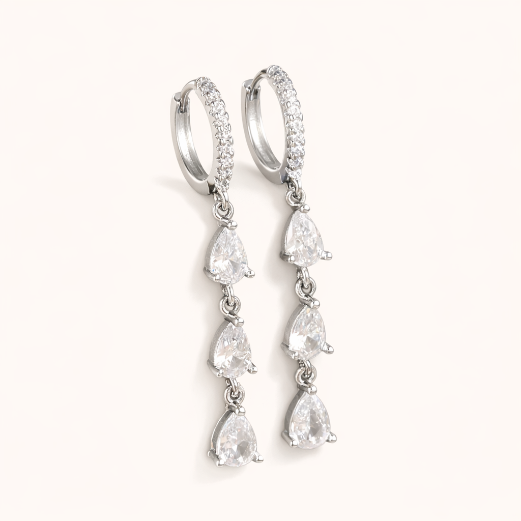 Waterfall Earrings in silver with clear crystals, showing the same pave hoop and cascading pear-drop design.