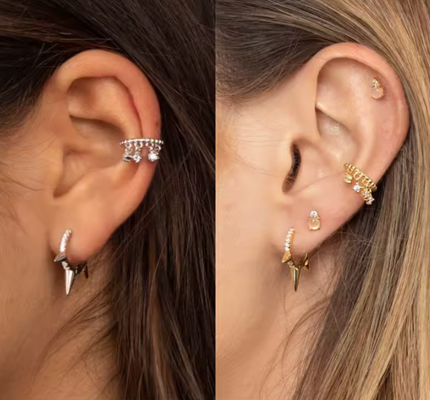 Wild Earring worn on the ear in silver and gold, the pave spike hoop styled with other small studs nearby.