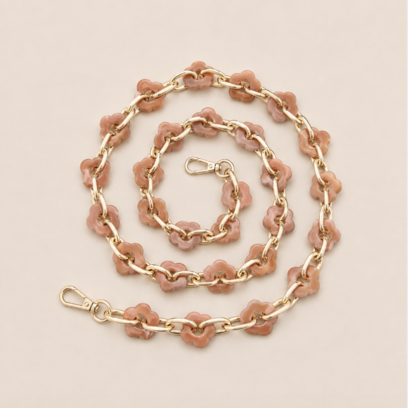 Coiled flower-link phone chain in dusty terracotta acrylic with gold chain links on cream — Folie à Trois Zinnia long phone chain