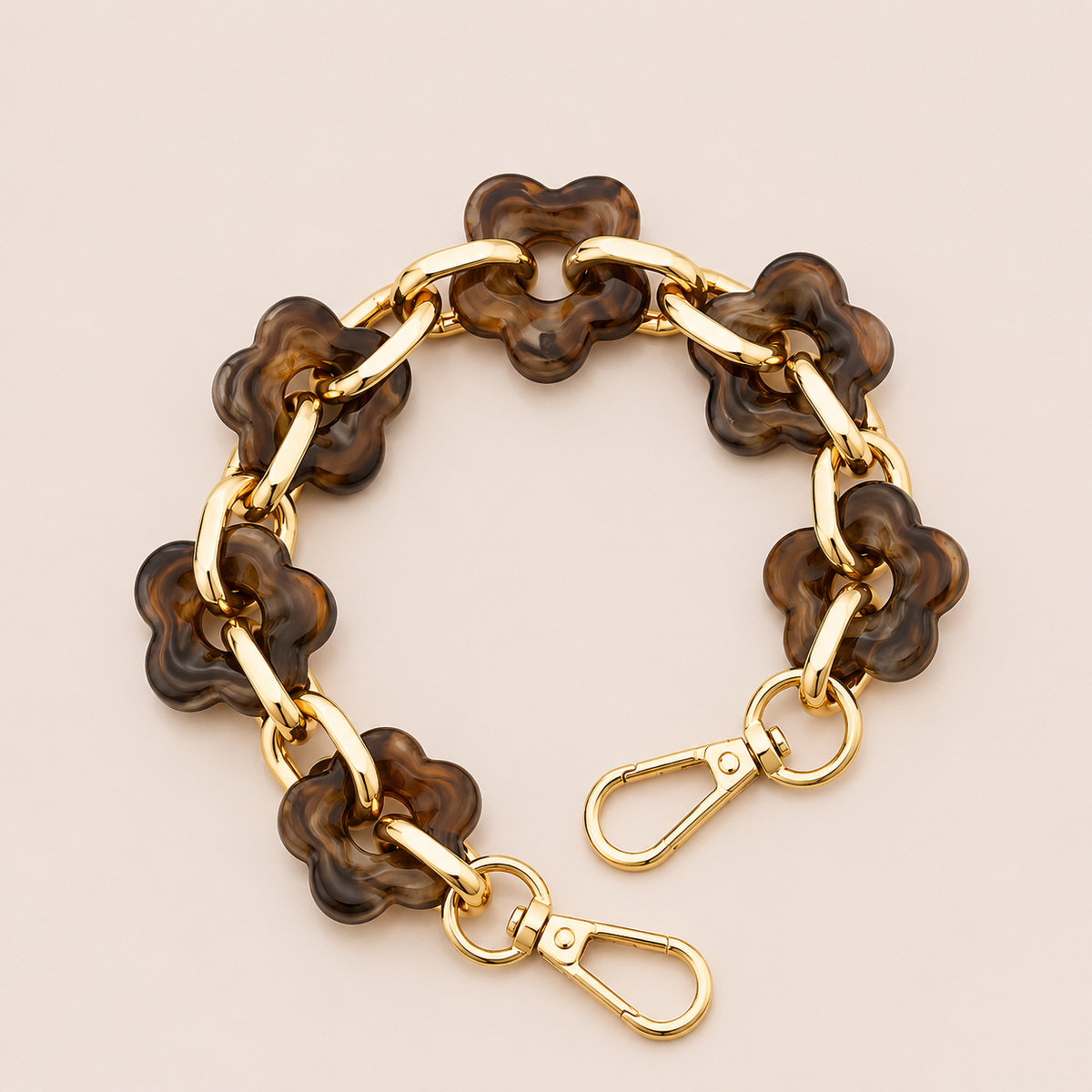 Round flower-link phone chain in deep brown tortoiseshell acrylic with gold chain links — Folie à Trois Zinnia short phone chain