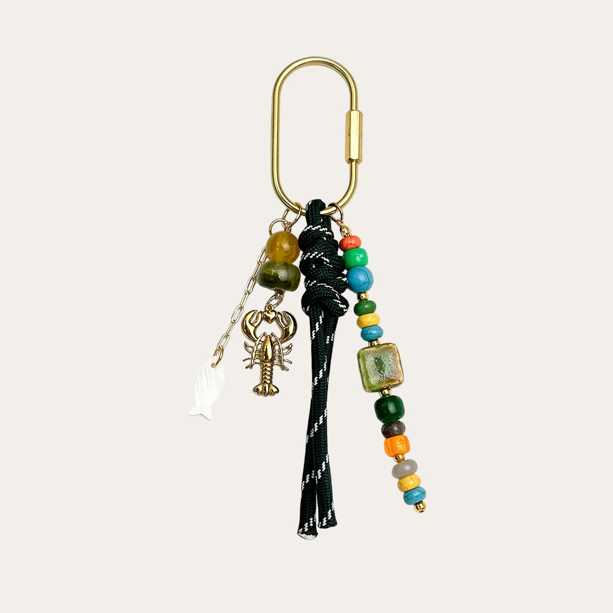 Marisol BAG CHARM Emerald - dark green woven cord with colorful beads and a gold-tone lobster charm