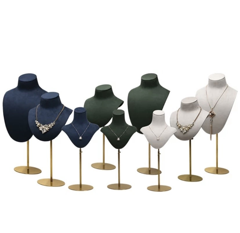 Range of Mannequin Velvet DISPLAY busts in navy, forest green and white velvet at different heights on gold stands.